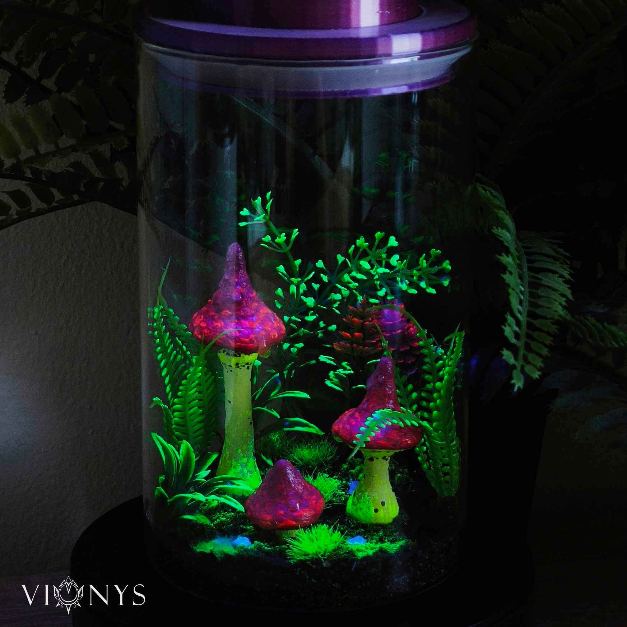 Fantasy LED lamp in UV variant with 3D printed yellow and pink mushrooms and vegetation inside.