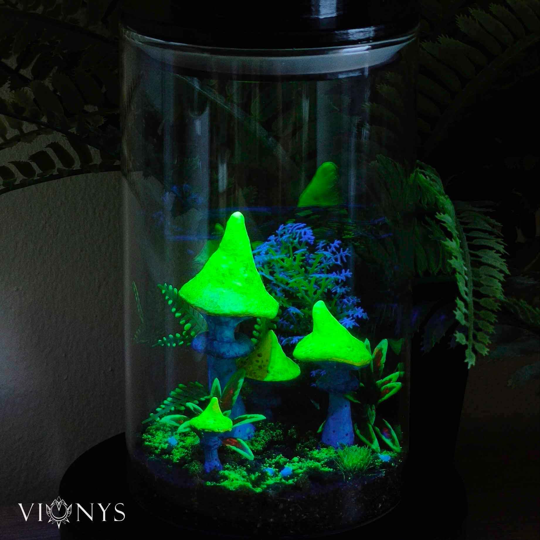 Fantasy LED lamp in UV variant with 3D printed yellow and blue mushrooms and vegetation inside.