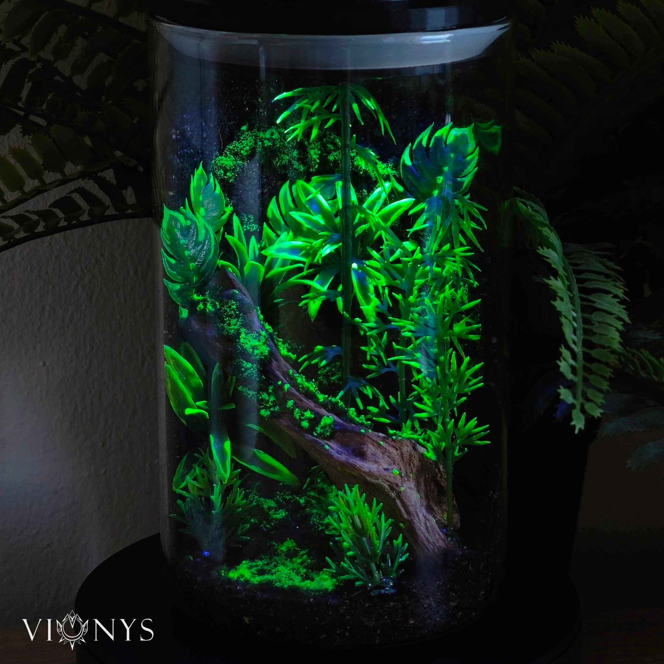 Fantasy LED lamp in UV variant with bamboo and vegetation inside.